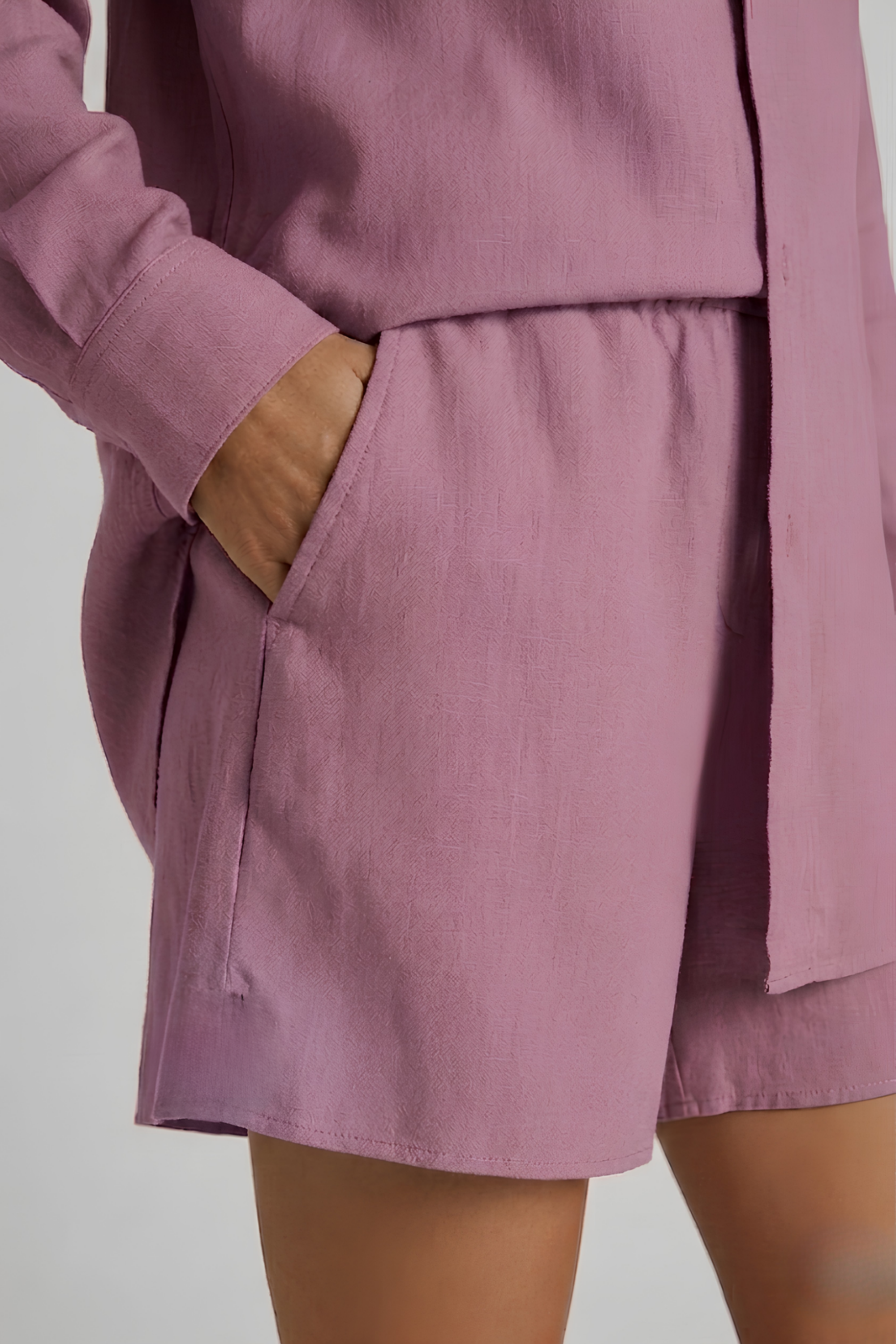 Close-up detail of the side pocket and elasticated waistband on the lilac Bamboo-Hemp shorts. #color_Lilac