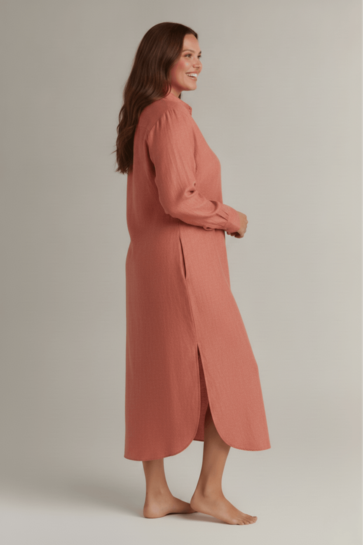 Side look of Rosewood button-down night dress showing side pockets and side slit. #color_Rosewood
