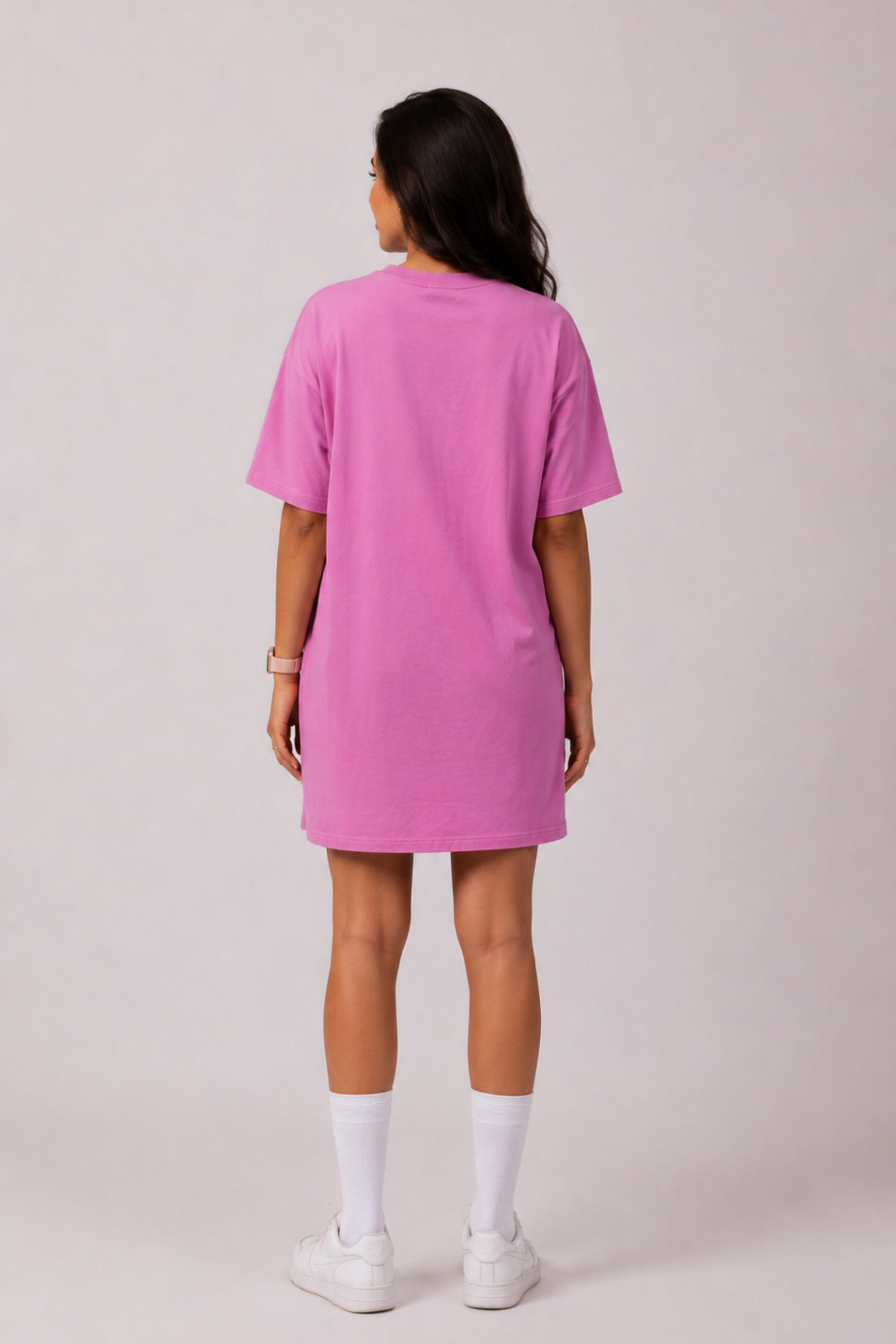 Side profile of a woman modeling the Snug Oversized Dress in Dusky Mauve, highlighting the comfortable half-sleeves and elevated loungewear style. #color_Mellow Mauve