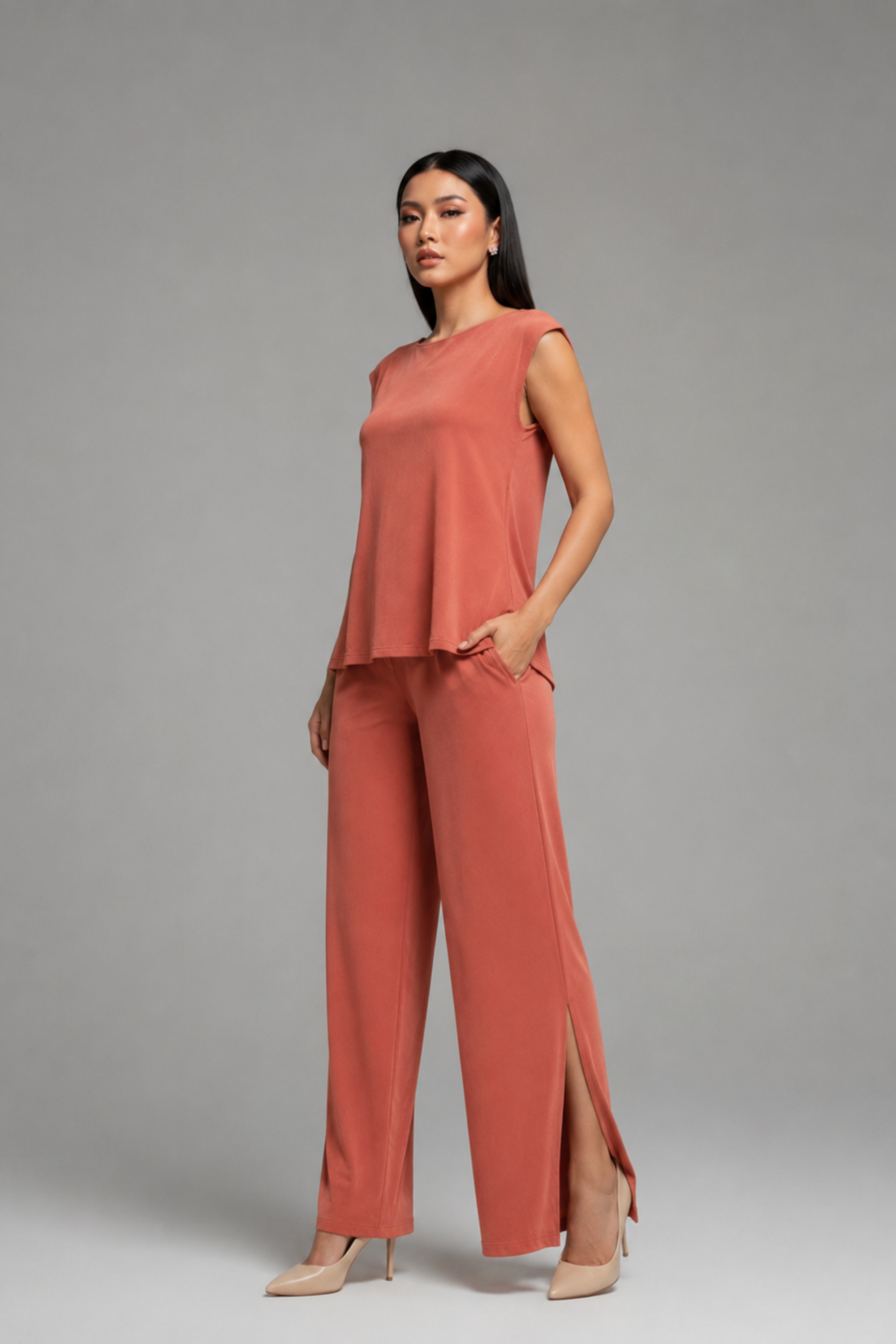 Side view of the Koye Ease Lounge Set showing the breathable bamboo cotton drape. #color_Coral
