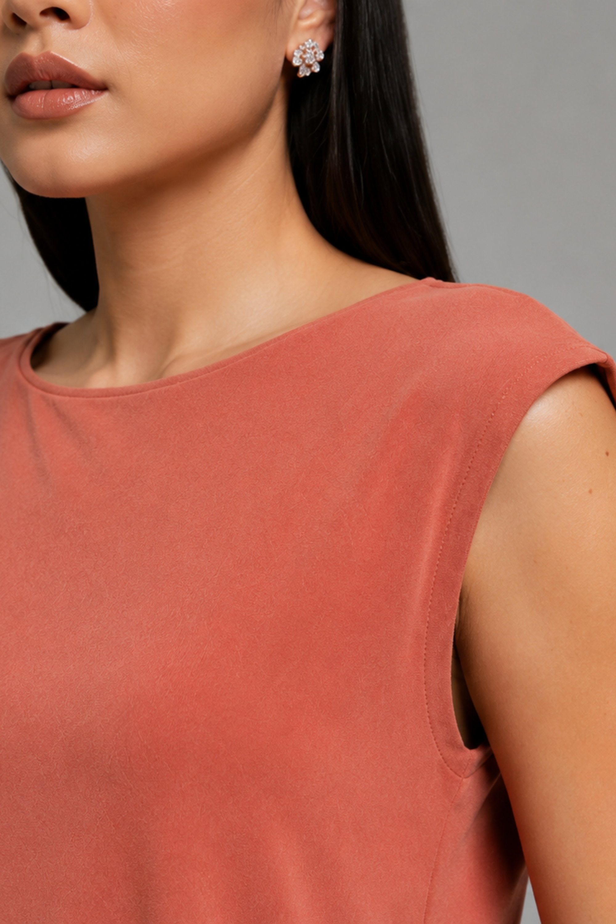 Close-up of the smooth bamboo cotton fabric and pocket detail on the Koye Ease Lounge Set. #color_Coral