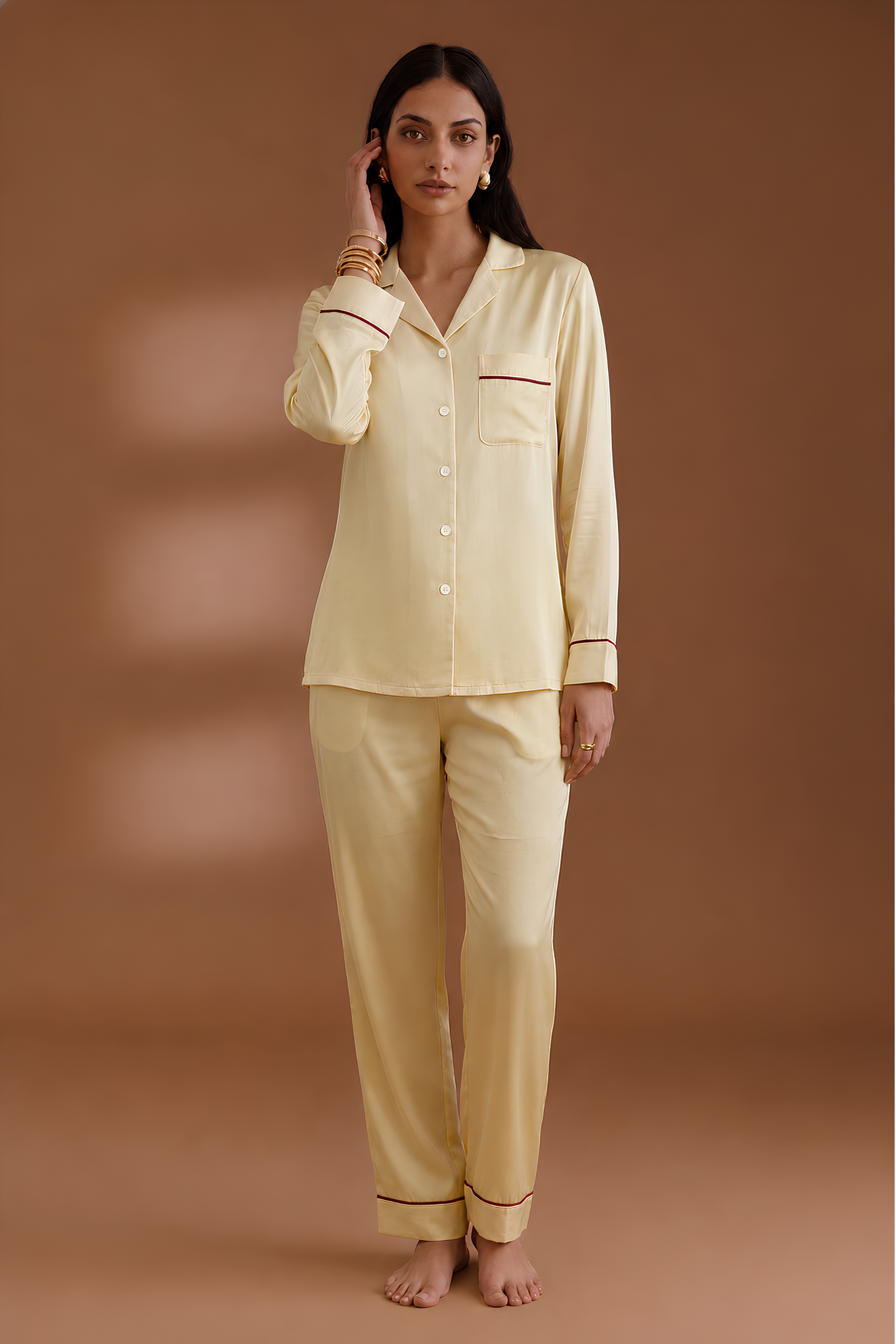 Front view of Koye Pause Pajama Set in Deep Oleev satin with button-down shirt. #color_Butter Yellow