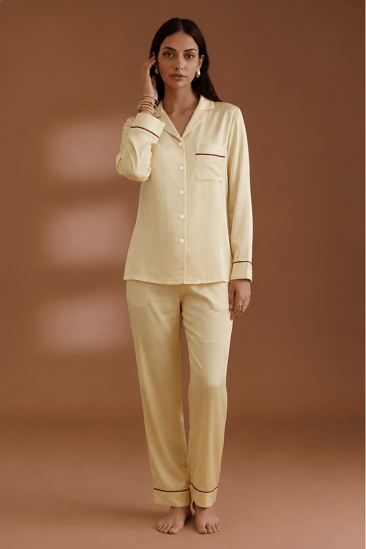 Front view of Koye Pause Pajama Set in Deep Oleev satin with button-down shirt. #color_Butter Yellow