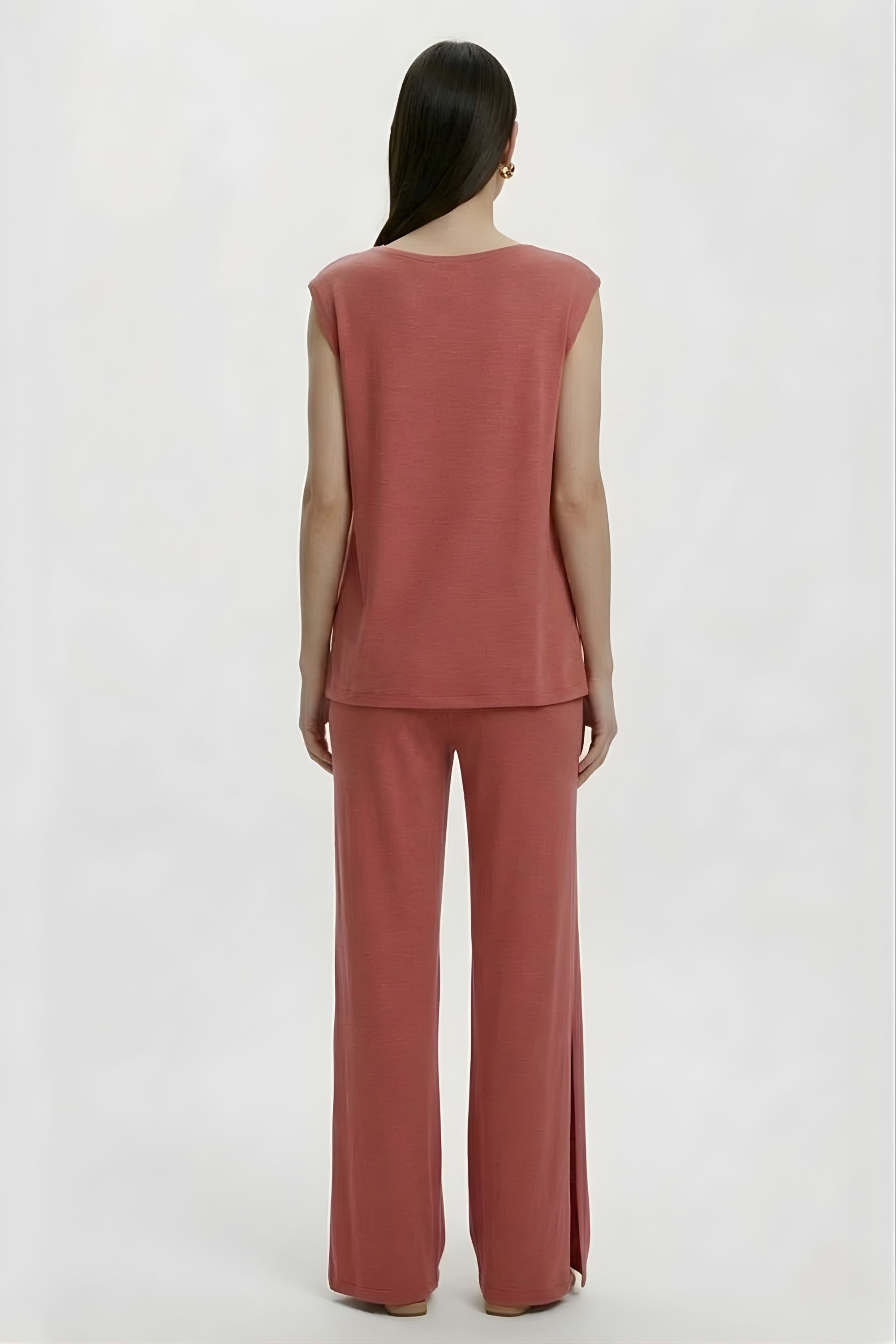 Back angle view of the Koye Ease Lounge Set showing the breathable bamboo cotton drape. #color_Coral