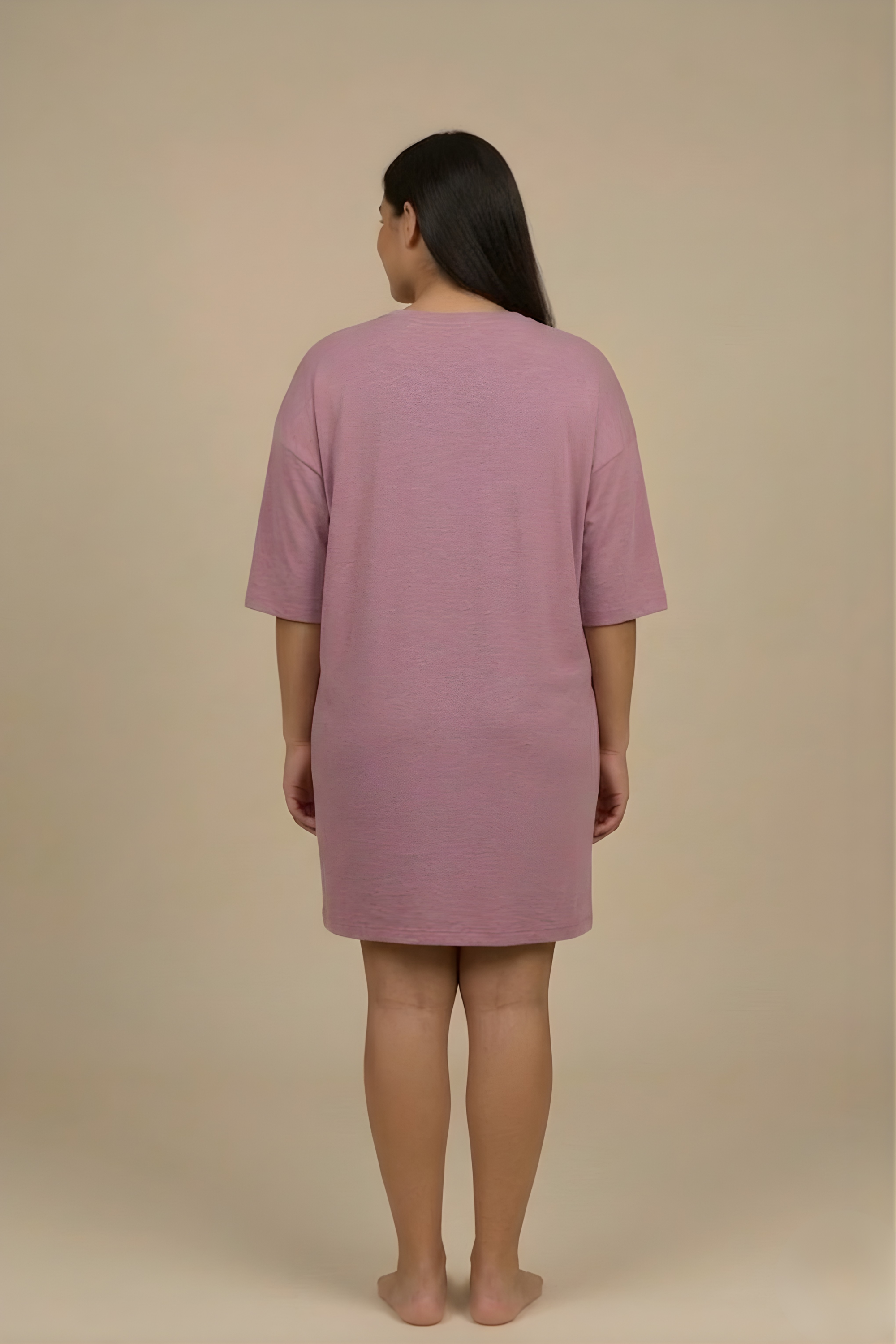 Back view of the Dusky Mauve Snug Oversized Dress, showcasing the relaxed, flowy fit that falls beautifully above the knee. #color_Mellow Mauve