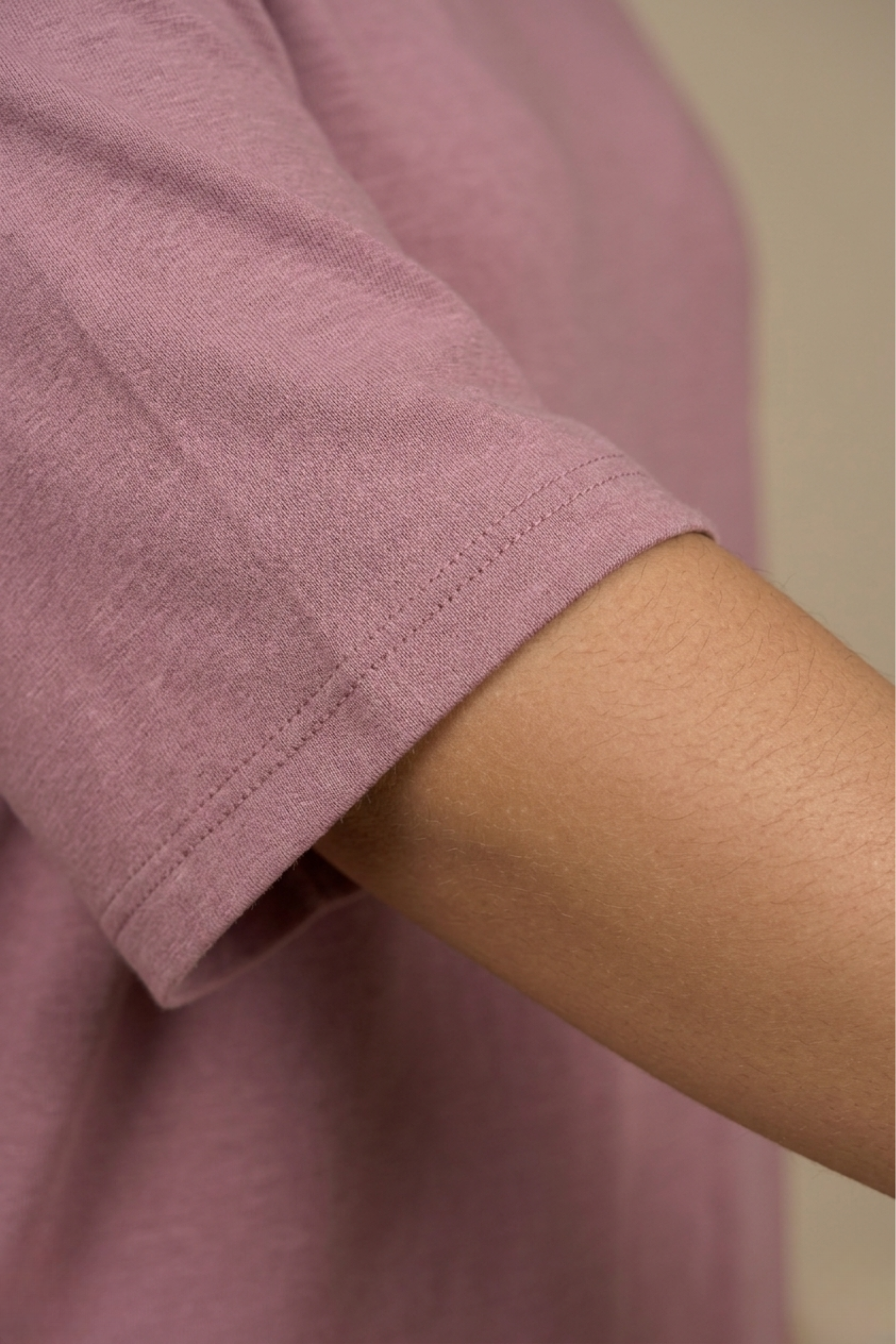Close-up detail of the smooth, structured bamboo-cotton fabric and neckline on the back of the Snug Oversized Dress. #color_Mellow Mauve
