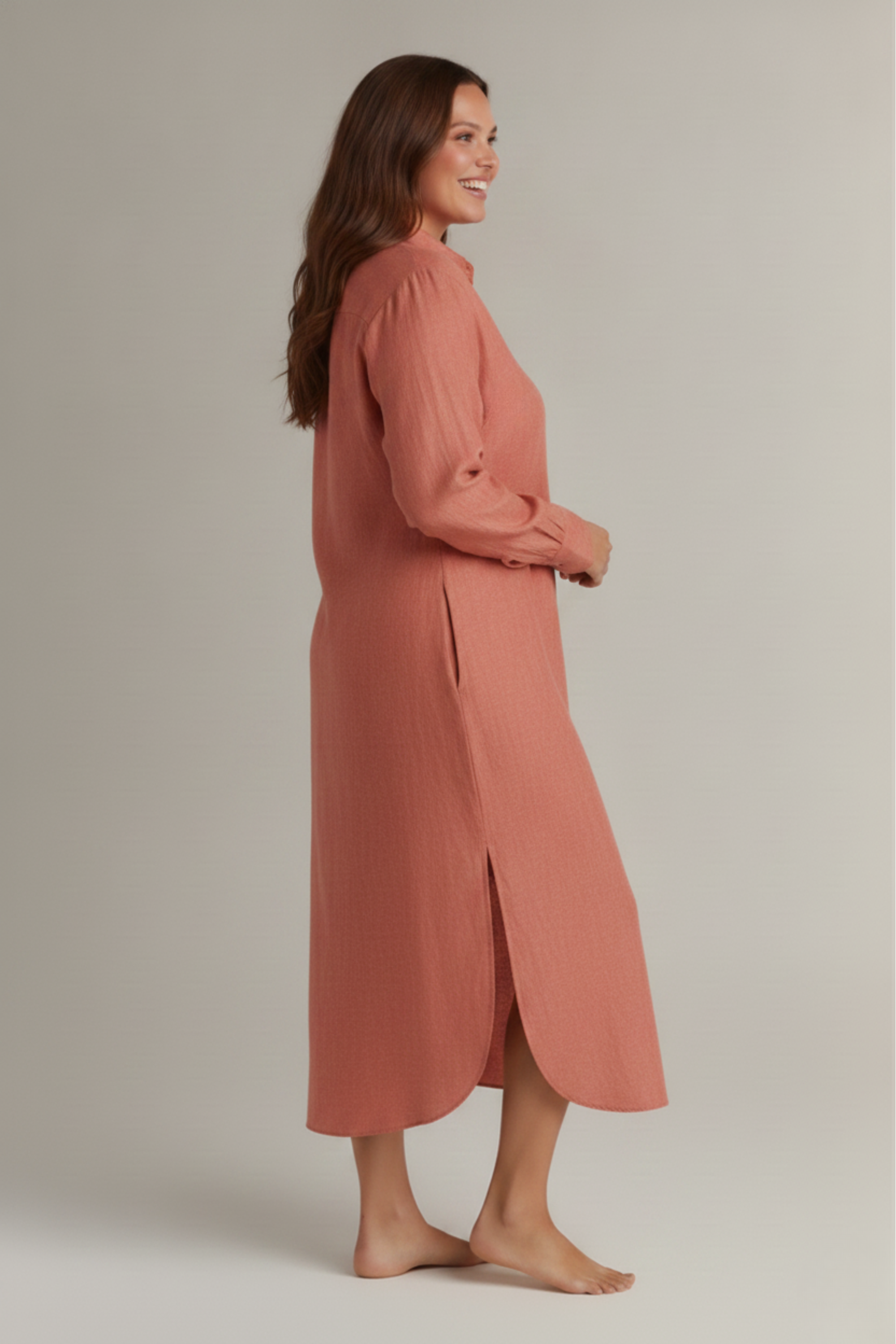 Side look of Rosewood button-down night dress showing side pockets and side slit. #color_Rosewood