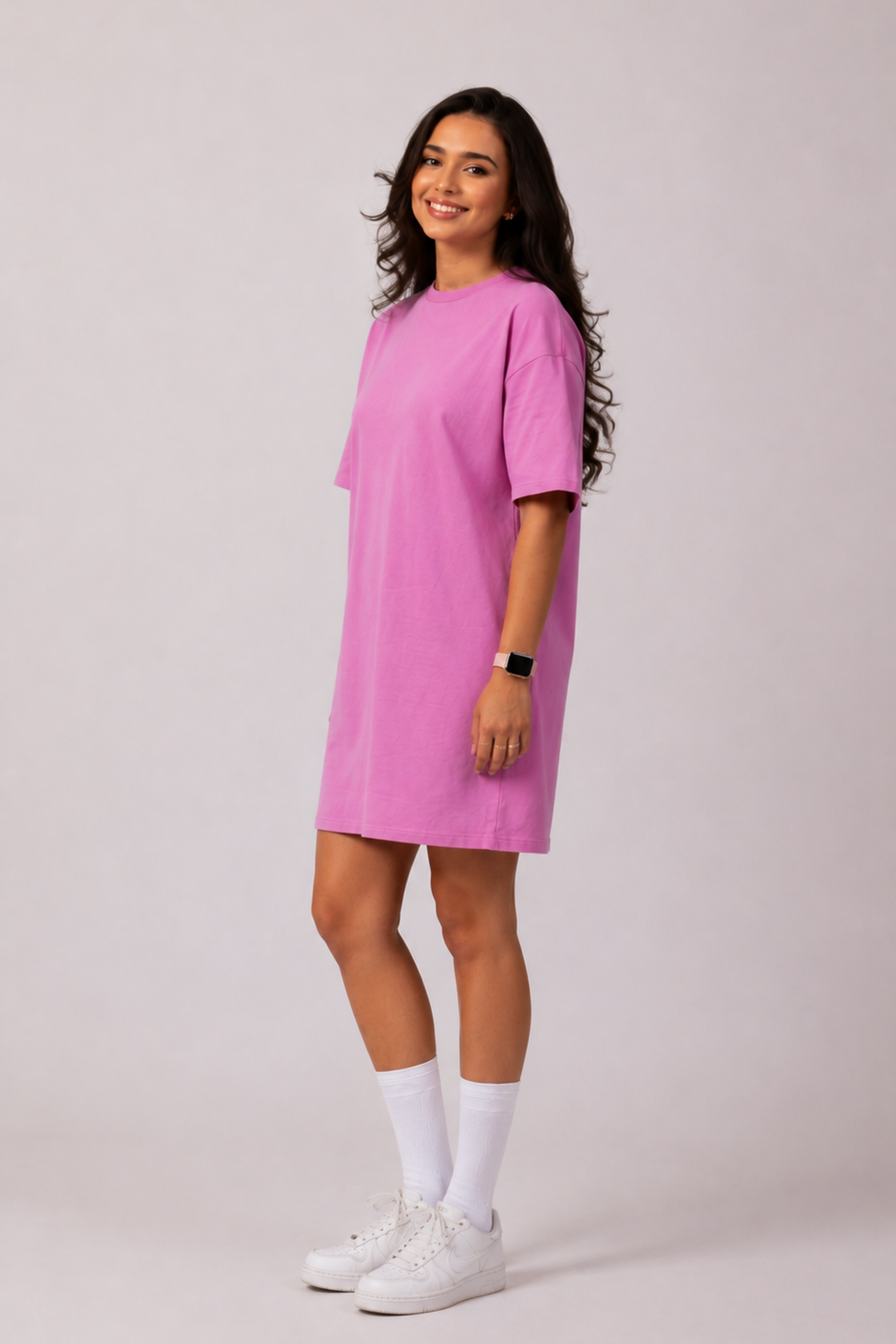 Side profile of a woman modeling the Snug Oversized Dress in Dusky Mauve, highlighting the comfortable half-sleeves and elevated loungewear style. #color_Mellow Mauve
