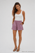 Woman modeling relaxed fit lilac Bamboo-Hemp Play Shorts. #color_Lilac