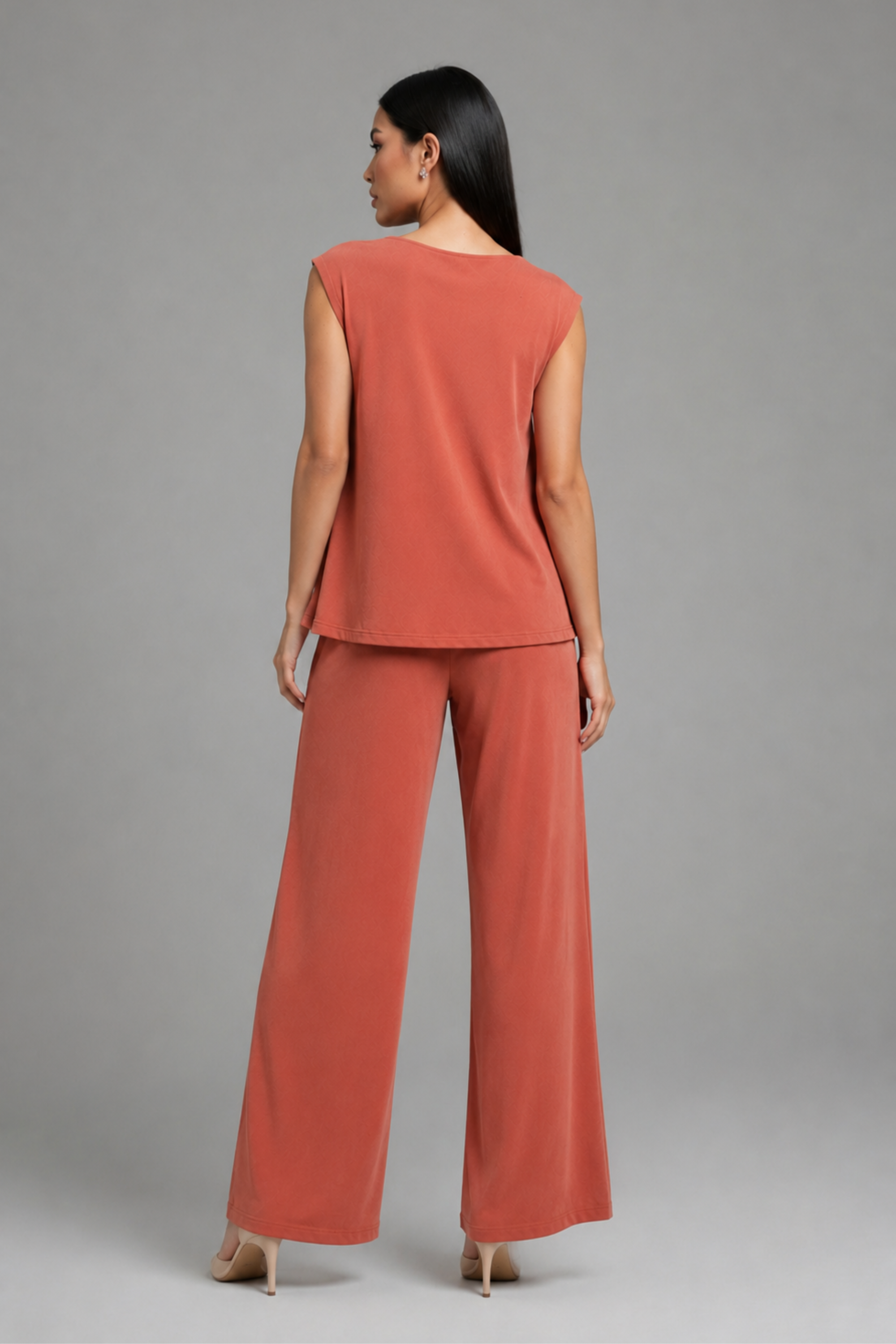 Back angle view of the Koye Ease Lounge Set showing the breathable bamboo cotton drape. #color_Coral