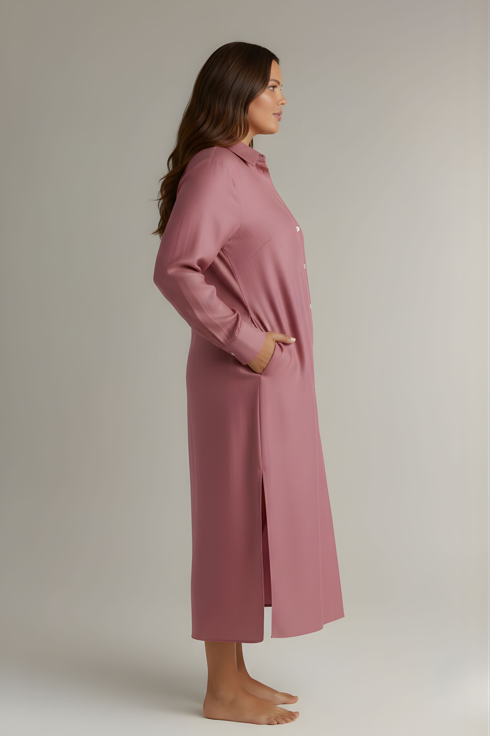 Side look of Rosewood button-down night dress showing side pockets and side slit. #color_Rosewood