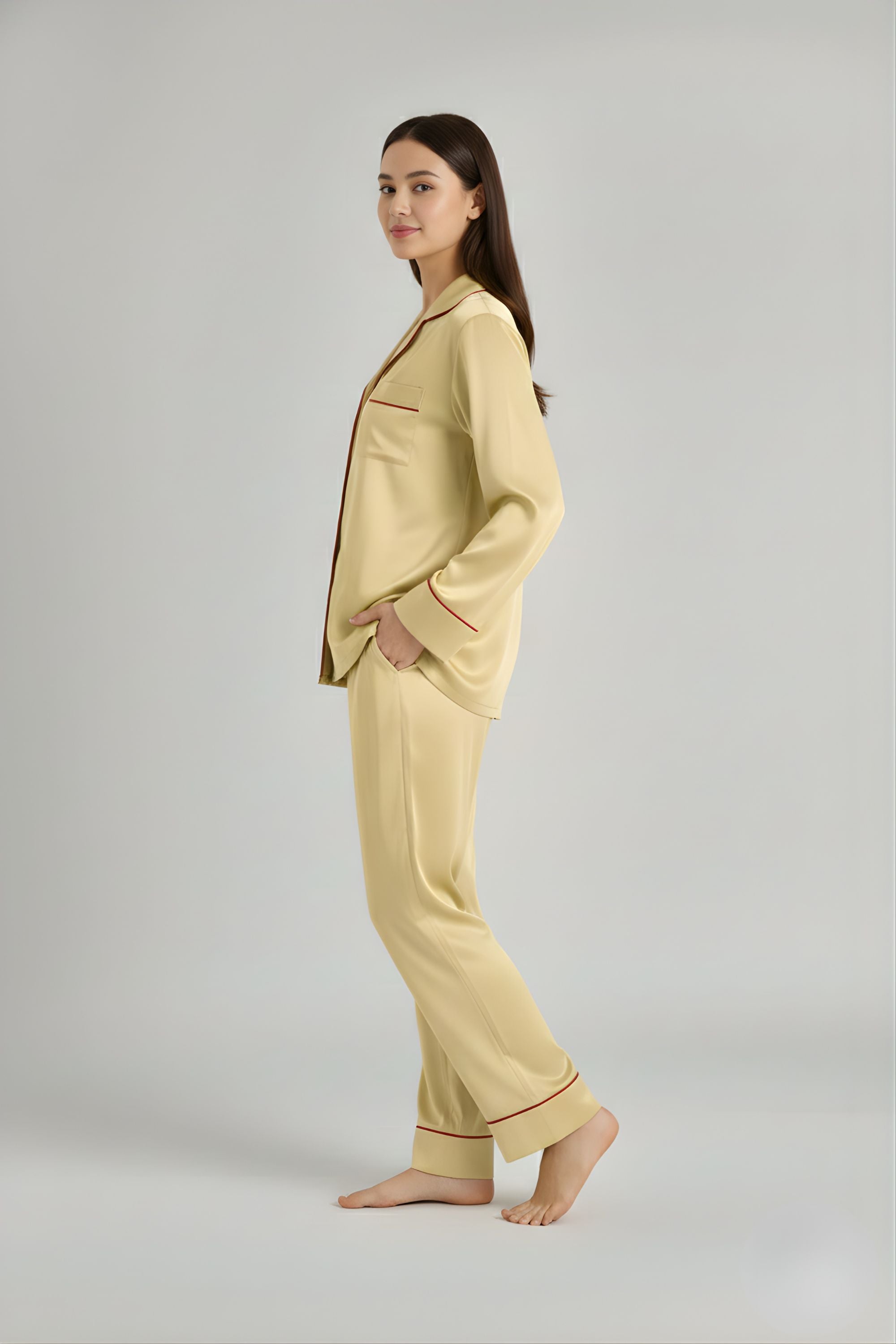 Side profile of woman in Koye satin lounge set showing side pockets and collar detail.  #color_Butter Yellow