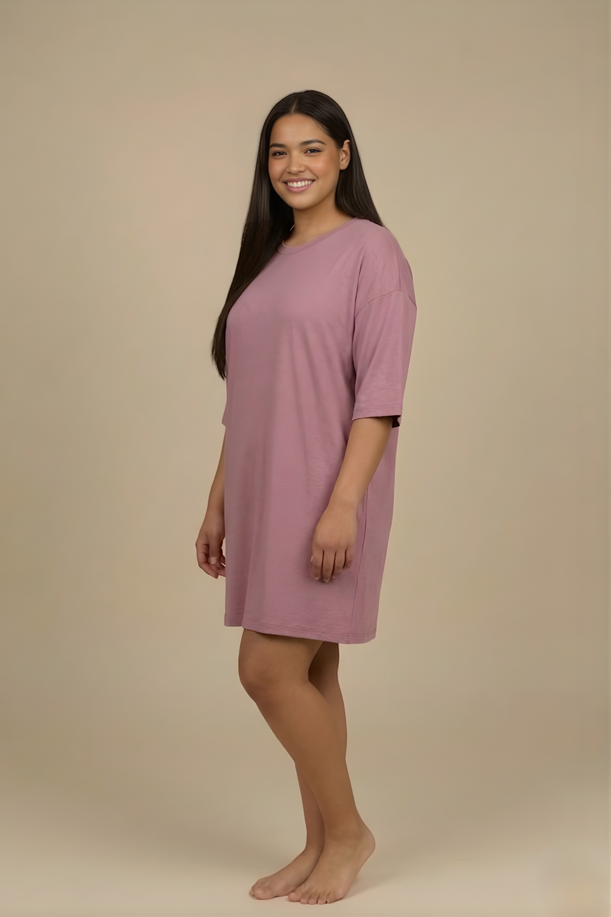 Side profile of a woman modeling the Snug Oversized Dress in Dusky Mauve, highlighting the comfortable half-sleeves and elevated loungewear style. #color_Mellow Mauve